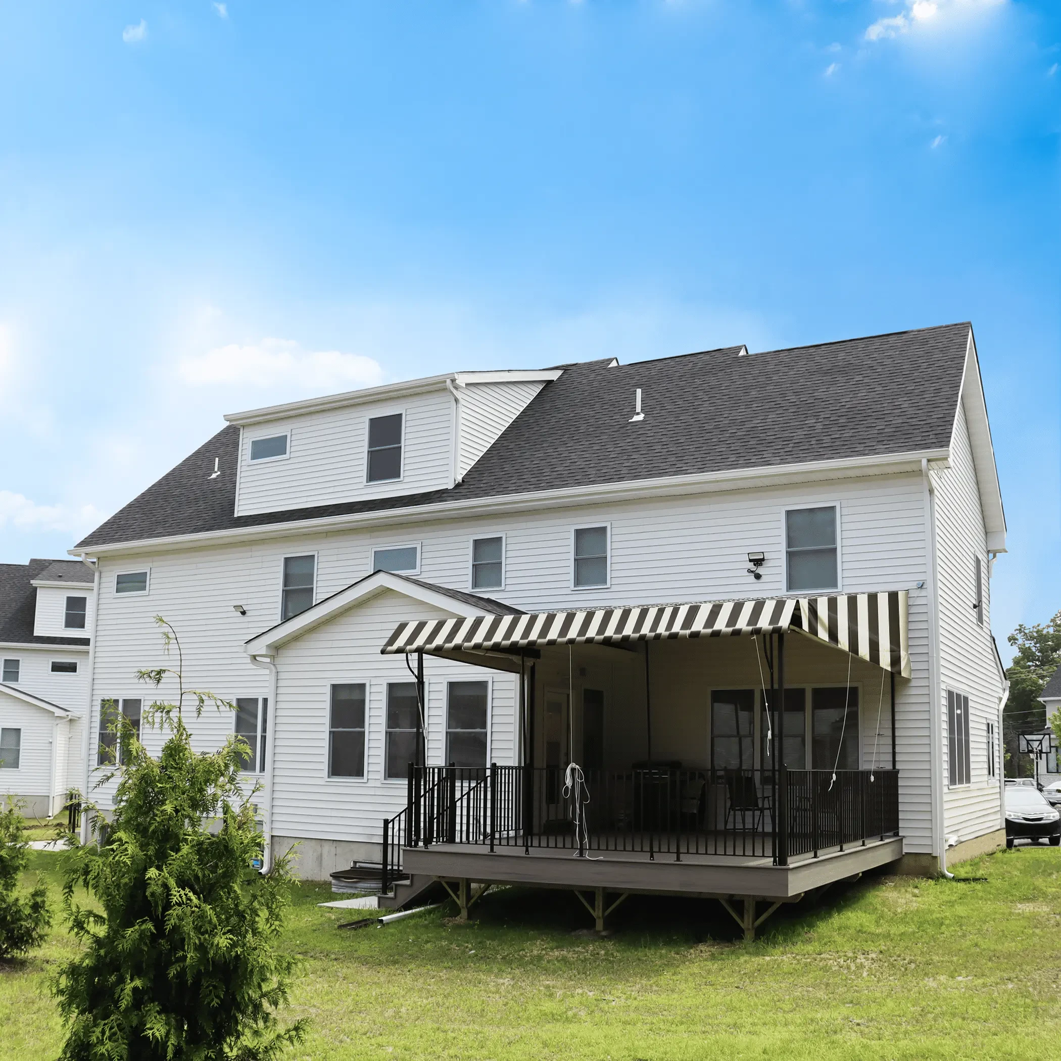 Roll up awning installation on residential home
