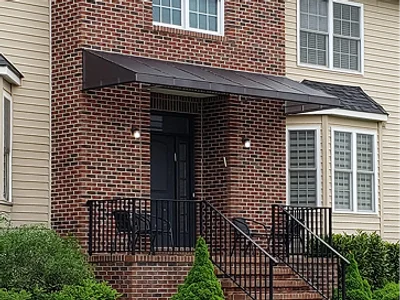 Plexiglass awning offering weather protection